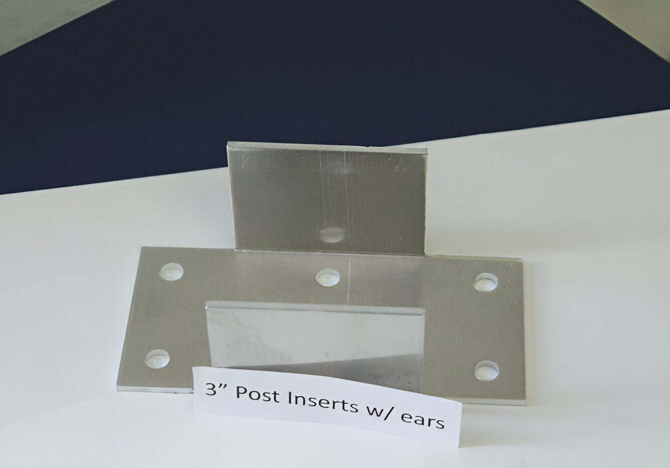Metal post inserts with ears displayed.