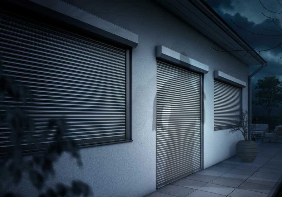House exterior with closed metal roller shutters