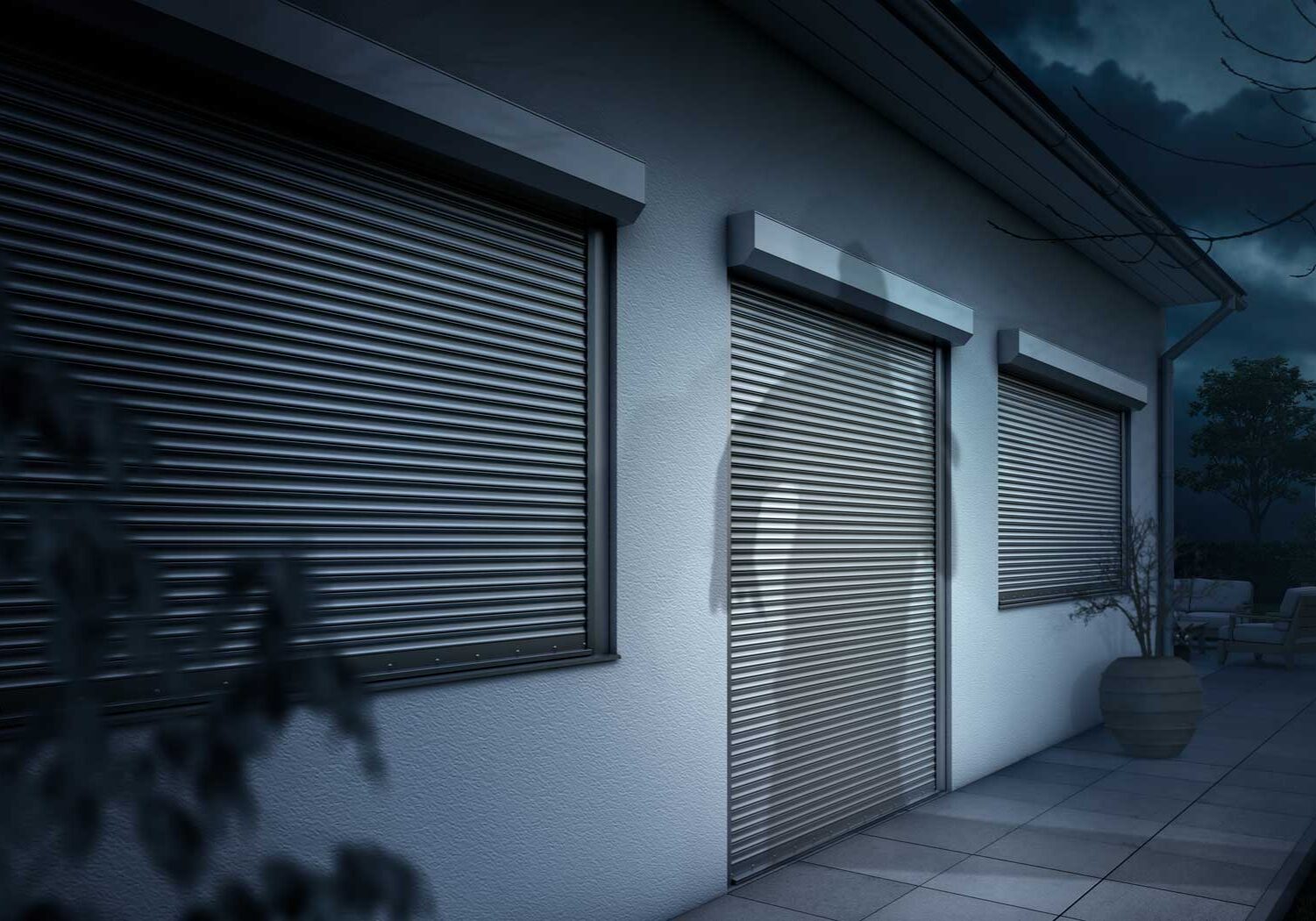 House exterior with closed metal roller shutters
